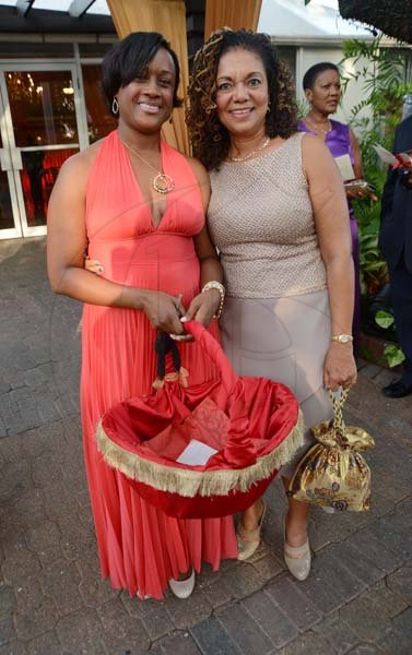 Rudolph Brown/Photographer
Alison Tulloch, (left) and Dr. Annette Crawford-Sykes pose at Sylvester and Eulyn Tulloch 40th Wedding Anniversary at the Terra Nova Hotel in Kingston on Saturday, August, 3, 2013