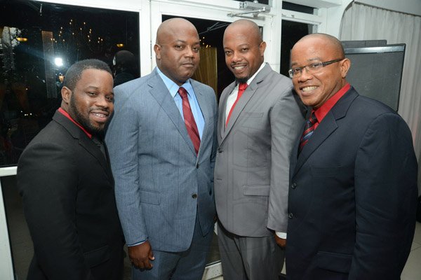 Rudolph Brown/Photographer
The Tulloch's sons from left are Romain Tulloch, Garwin Tulloch, Karl Tulloch and Handel Tulloch pose at their parents Sylvester and Eulyn Tulloch 40th Wedding Anniversary at the Terra Nova Hotel in Kingston on Saturday, August, 3, 2013