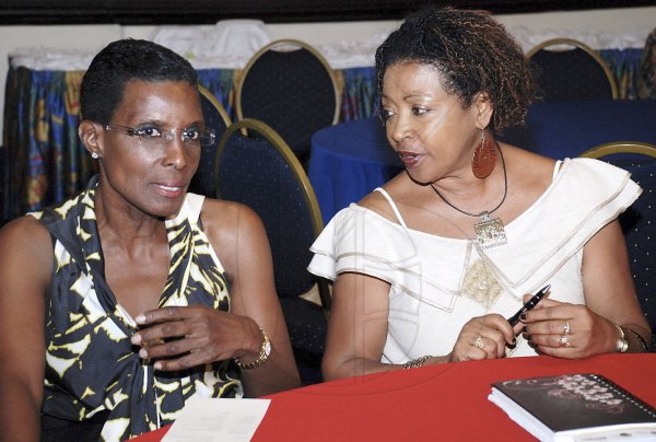 Professor Verene ( right) 

Shepherd converses with  Myrtha Desulme, president of the Haiti-Jamaica Society at  the closing ceremony of  UWI's the 50/50 Conference