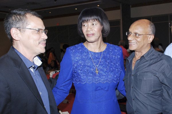 - Colin Hamilton

Prof. Brian Meeks (left) has the aattention of  Prime Minister Portia Simpson-Miller and  Prof. Treavor Munroe at the closing ceremony of the  closing Ceremony of UWI's 50/50 Conference at the Pegasus  Hotel on Friday.