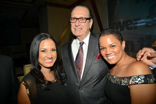 Rudolph Brown/Photographer
R Danny Williams pose with Arnella Goubault and Alexisse Chin (right) Admark 50th Anniversary Banquet at  at the Jamaica Pegasus on Tuesday, April 14