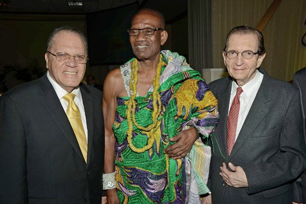 Rudolph Brown/Photographer
King Accra Nii Kpobi Tettey, (centre) Tsuru III of Ghana pose with Edward Saga and Arnold Foote  at Admark 50th Anniversary Banquet at the Jamaica Pegasus on Tuesday, April 14