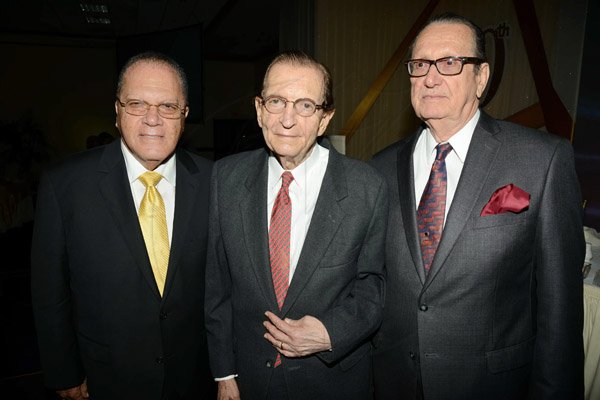 Rudolph Brown/Photographer
Edward Saga pose with R Danny Williams, (right) and Arnold Foote  at Admark 50th Anniversary Banquet at the Jamaica Pegasus on Tuesday, April 14