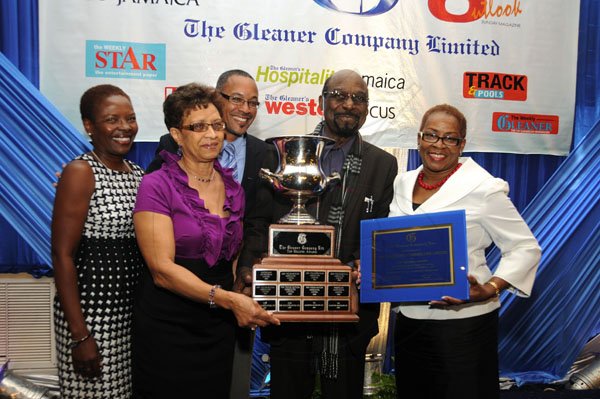 Gladstone Taylor / Photographer

The Marketing Counselors boss Adrian Robinson (second right) and staff member Eileen Lewis (second left) show off the Top Billing award with Gleaner Managing Director Christopher Barnes (centre), Advertising Operations Manager Nordia Craig (left) and Business Development and Marketing Manager Karin Cooper.

Jamaica Gleaner hosts advertisers appreciation and agency awards luncheion held at the jamaica Pegasus, kingston