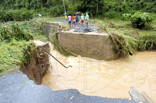 Ricardo Makyn/Staff Photographer.
The Bridge that connects the Dover Castle main Road to the Redwood District in St Catherine washed away due to the heavy Rains on Thursday 30.9.2010.