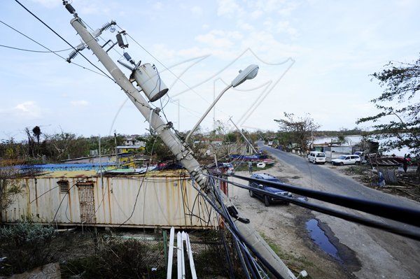 Ricardo Makyn/Staff Photographer 
Collapsed Light Poles in  Manchioneal Portland  after  the passage of Hurricane Sandy