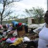 Ricardo Makyn/Staff Photographer 
Corena Stewart of Grange Hill Portland shows what remains of Her Home after the passage of Hurricane Sandy