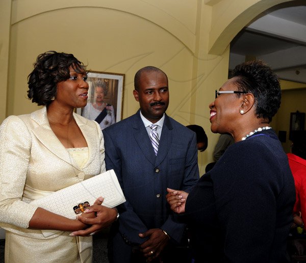 Winston Sill / Freelance Photographer
Swearing-In Ceremony of Dirk E, Harrison as Contractor General, held at King's House, Hope Road on Monday February 25, 2013. Here are Diahann Gordon-Harrison (left); Dirk Harrison (centre); and Paula llewellyn (right), DPP.