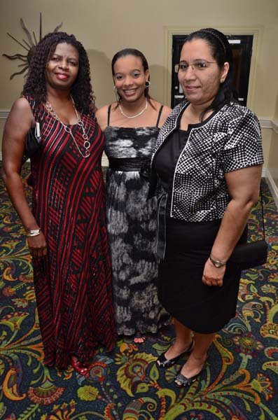 Rudolph Brown/Freelance Photographer
The official opening and cocktail of the Association of Insurance Institute of?Caribbean AIIC 14th Annual Insurance education conference for Caribbean host by Insurance Institute of Jamaica at the Knutsford Court Hotel in Kingston on Wednesday, November 9-2011.
From left Ruth Lake, Janelle Frederick and Mary Nagasar pose at the opening.