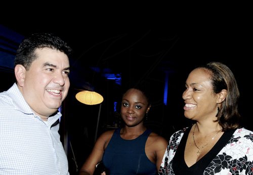 Winston Sill / Freelance Photographer
Jesus Hung, Caribbean Manager for Alcatel One Touch jokes with Rachael Lindo-Hall (right) head of distribution, Digicel Group and Zauditu Howe, distribution executive.




Launch of Alcatel new one touch phone, held at Devon House, Hope Road on Tuesday night December 6, 2011.