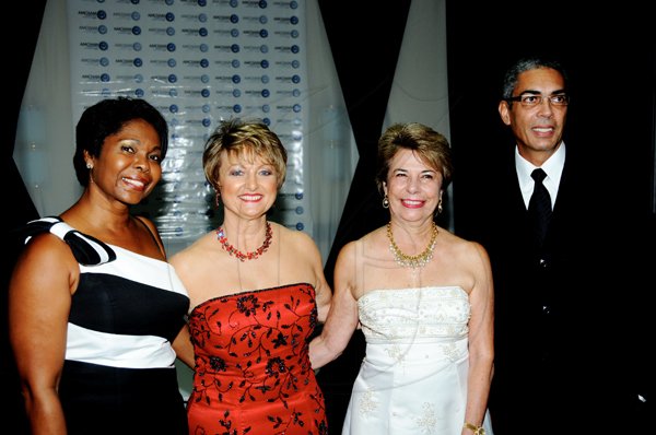Winston Sill / Freelance Photographer
Jacinth Byles (left); Becky Stockhausen (second left); Diana Stewart (second right); and Richard Byles are in a good mood at the AMCHAM Business and Civic Leadership Awards gala and presentation, held at the Jamaica Pegasus hotel, New Kingston on Monday night.

***************************************************************** September 26, 2011. Here are Jacinth Byles (left); Becky Stockhausen (second left); Diana Stewart (second right); and Richard Byles (right).