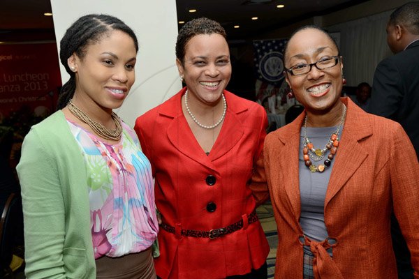Rudolph Brown/Photographer
Suzanne Palomino, (centre) Head of Business Sales, Digicel pose with Rene Allen Casey,(right) Professional Services Manager of CSS and Ayanna Kirton at the AMCHAM Digicel Christmas  luncheon EXTRAVAGANZA at the Jamaica Pegasus Hotel on Thursday, December 5, 2013