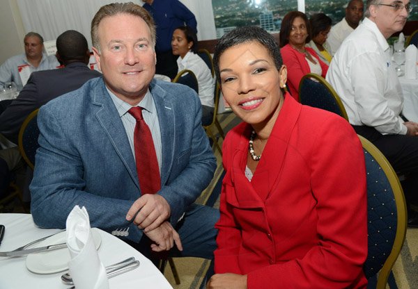 Rudolph Brown/Photographer
Audrey Marks, Chairman and Managing Director of Paymaster (Jamaica) Limited pose with Ronald McKay, CEO of CTICO at the AMCHAM Digicel Christmas  luncheon EXTRAVAGANZA at the Jamaica Pegasus Hotel on Thursday, December 5, 2013