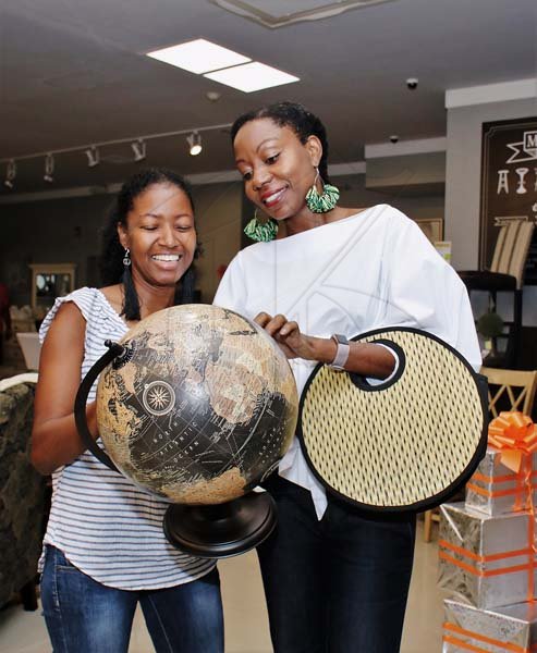 Ashley AnguinSharon Cunningham of Mema Designed (left) and Dr Claudine Lewis seemed to have found a piece that would go great in their home this Christmas.