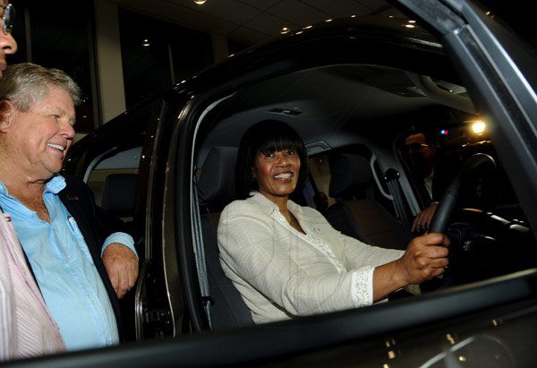 Winston Sill / Freelance Photographer
Prime Minister Portia Simpson-Miller officially open ATL Automotive, Volkswagen and Audi Showrooms, held at Oxford Road, New Kingston on Friday night April 19, 2013. Here are Gordon "Butch" Stewart (left); and Prime Minister Portia Simpson-Miller (right).