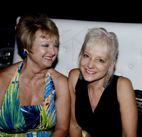 Winston Sill/Freelance Photographer
The American Women's Group of Jamaica (AWGJ) host Escapade Party, held at AISK, College Green Avenue, Hope Pasters on Saturday night May 17, 2014. Becky Stockhausen looks on joyfully as Kelly Tomblin smiles for our cameras