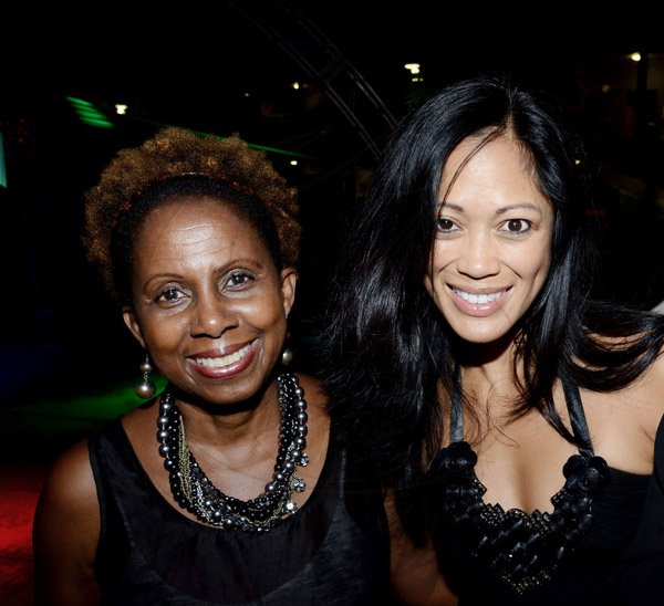 Winston Sill/Freelance Photographer
The American Women's Group of Jamaica (AWGJ) host Escapade Party, held at AISK, College Green Avenue, Hope Pasters on Saturday night May 17, 2014. The president of the American Women's Group of Jamaica Dianne Grant (left) shares the spotlight with Jade Newman