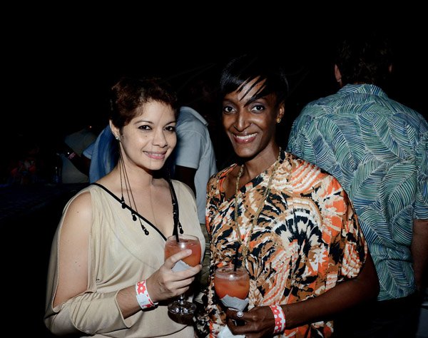 Winston Sill/Freelance Photographer
The American Women's Group of Jamaica (AWGJ) host Escapade Party, held at AISK, College Green Avenue, Hope Pasters on Saturday night May 17, 2014. Jenelle Babb (right) and Christine Morisson share the spotlight with the signature drink of the night: Escapini.