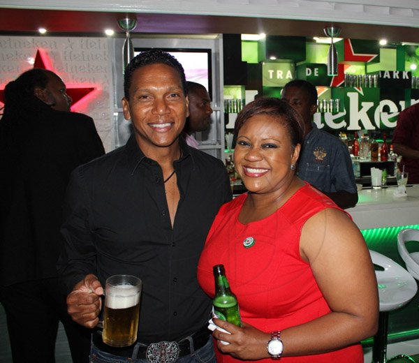 Contributed Photo 
Chris Dehring Chairman of LIME Jamaica and Nasha Douglas Brand Manager Heineken were out to support famed cricketer Chris Gayle at the opening of his sports bar Triple Century in New Kingston on Wednesday October 9, 2013.