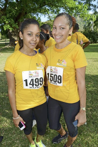 Rudolph Brown/Photographer
Desiree Lopez, (left) and Jeanel Bowla at the Best Dressed Chicken 5K Road Race Series 2013 at Hope Garden on Sunday, March 24, 2013.