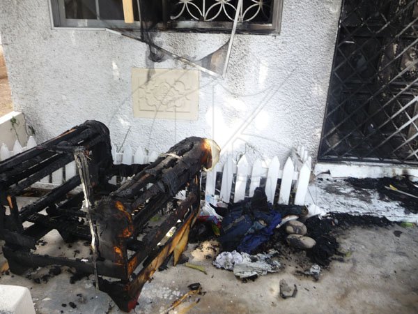 A chair on Blak Ryno's  Winchester Court Apartment verandah was damaged beyond repair,clothes thrown down outside were also destroyed after a firebomb incident which took place on Wednesday March 3, 2010.
