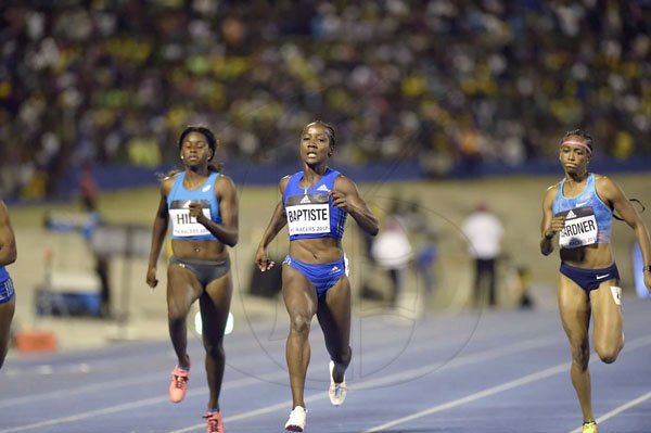 Gladstone Taylor/Photographer

Kellyann Baptiste (center) of Trinidad and Tobago wins the Women's 100m sprint in 11.13 seconds at the JN Racers Grand Prix at the National Stadium on Saturday June 10, 2017. She USA's Jenna Prandini (not in photo) was second in 11.16 seconds and Jamaica's Natasha Morrison third in 11.26 seconds. Also in this photo are USA's English Gardner (left) who finished fifth and Candice Hill, in eighth. *** Local Caption *** Gladstone Taylor/Photographer

Kellyann Baptiste (center) of Trinidad and Tobago wins the Women's 100m sprint in 11.13 seconds at the JN Racers Grand Prix at the National Stadium on Saturday night. She USA's Jenna Prandini (not in photo) was second in 11.16 seconds and Jamaica's Natasha Morrison third in 11.26 seconds. Also in this photo are USA's English Gardner (left) who finished fifth and Candice Hill, in eighth.