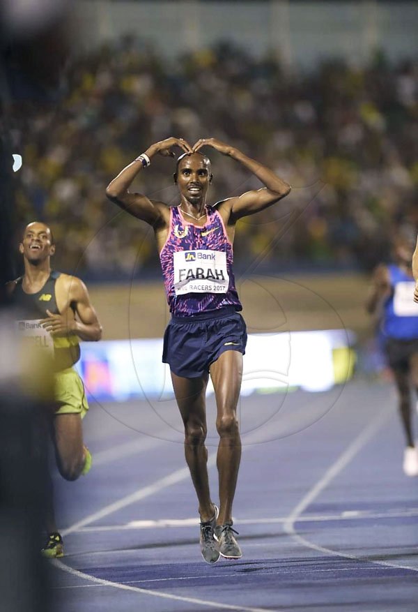 Gladstone Taylor/Photographer

Great Britain's Mo Farah (center) does his trademark pose after winning the men's 3000m run in a time of 7:41.20 in the JN Racers Grand Prix on Saturday June 10, 2017 at the National Stadium. Australia's Pat Tierman was second in 7:41.62 and Jamaica's Kemoy Campbell (right), third in 7:41.87. *** Local Caption *** Gladstone Taylor/Photographer

Great Britain's Mo Farah (center) does his trademark pose after winning the men's 3000m run in a time of 7:41.20 in the JN Racers Grand Prix on Saturday night at the National Stadium. Australia's Pat Tierman was second in 7:41.62 and Jamaica's Kemoy Campbell (right), third in 7:41.87.