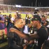 x *** Local Caption *** Ricardo Makyn/PhotographerJamaica's sprint legend Usain Bolt is greeted by Prime Minister Andrew Holness before a massive crowd at the JN Racers Grand Prix inside the National Stadium last night.