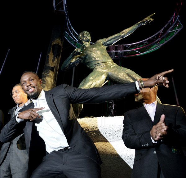 Rudolph Brown/PhotographerUnveiling of Usain Bolt statue at the National Stadium on Sunday, December 3, 2017 *** Local Caption *** Rudolph Brown/PhotographerUsain Bolt does his famous 'To The World' pose at the unveiling of his statue at the National Stadium on Sunday night.
