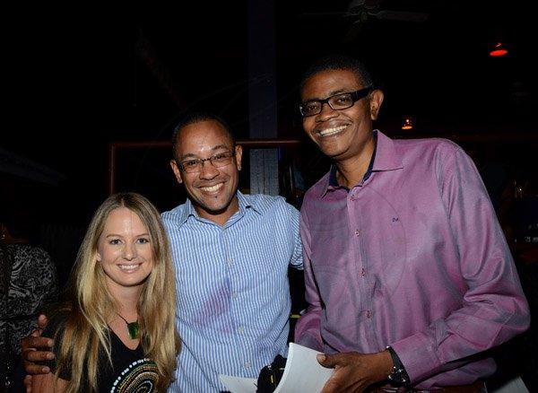 Winston Sill/Freelance Photographer
Launch of Calabash Festival 2014 under the theme "Globalishus", held at Red Bones Blues Cafe, Arygle Road on Thursday night March 20, 2014. Here are Justine Henzell's  daughter (left); Christopher Barnes (centre); and Dr. David McBean (right).