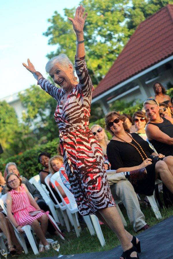 Beth Hyde McDonald having a grand time while showing off a Sandra Kennedy wrap dress design, something that Diane von Fürstenberg can truly appreciate.