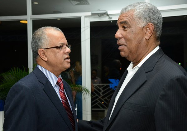 Rudolph Brown/Photographer
Business Desk
Jagmohan Singh, (left) Acting CEO of Caribbean Airline chat with John Lynch, Director of JTB at the Caribbean Airlines awards and Corporate Event at the Jamaica Pegasus Hotel on Friday, November 15, 2013