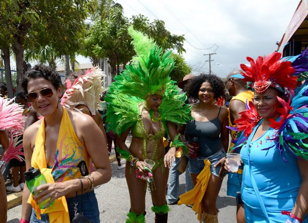 Winston Sill/Freelance Photographer
Bacchanal Jamaica Road Parade, from Mas Camp, Stadium North to Half Way Tree and back, held on Sunday April 27, 2014. Here are Michelle Rousseau (left); ----??? (second left); Suzanne Rousseau (second right); and Corah Ann Robertson-Sylvester (right).