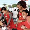 Winston Sill/Freelance Photographer
From left Miss Universe Kaci Fennel, Ashley Miller  and Talia Soares having fun during their celebrity cook-off at the CB  Pan Chicken Finals and Concert,  at the Kingston  Waterfront, Ocean Boulevard on Sunday November 23, 2014.