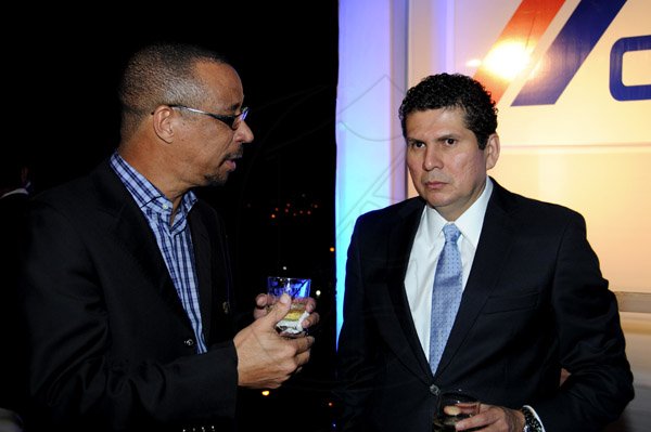 Winston Sill / Freelance Photographer
Function to mark the Official Launch of CEMEX Jamaica Limited new Corporate Office, held at the Courtleigh Corporate Centre, St. Lucia Avenue, New Kingston on Wednesday night February 20, 2013. Here are Dr. Rollin Bertrand (left), Group CEO, TCL; and Carlos Gonzalez (right), President, CEMEX Caribbean.