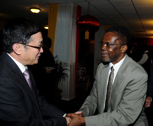 Winston Sill / Freelance Photographer
Chinese Ambassador Qingdian Zheng host China National Day Reception, held at the Jamaica Pegasus Hotel, New Kingston on Wednesday night September 26, 2012. Here are Ambassador Zheng (left); and Nii Allotey Odunton (right).