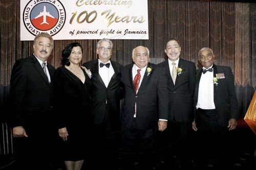 Contributed
From left: Captains Brian Haddad, Maria Ziadie  Haddad, 
 Christopher Kirkcaldy,  Robert Hamaty, Lloyd Tai and 
Major Victor Beek, pose for photographers at the  Jamaica Civil Aviation Authority Aviation Industry Awards dinne at the Jamaica Pegasus hotel on Saturday December 10.