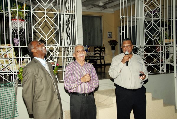 Contributed
 Trevor MacMillan


*********************************************************** aRetiring permanent secretary in the Ministry of National Security, Gilbert Scott (left) is tickled about something one of his former bosses, Dr. Peter Phillips (right) has to say during a retirement function for Mr. Scott, hosted Security Minister, Colonel Trevor MacMillan at his Jacks Hill home on Tuesday evening.