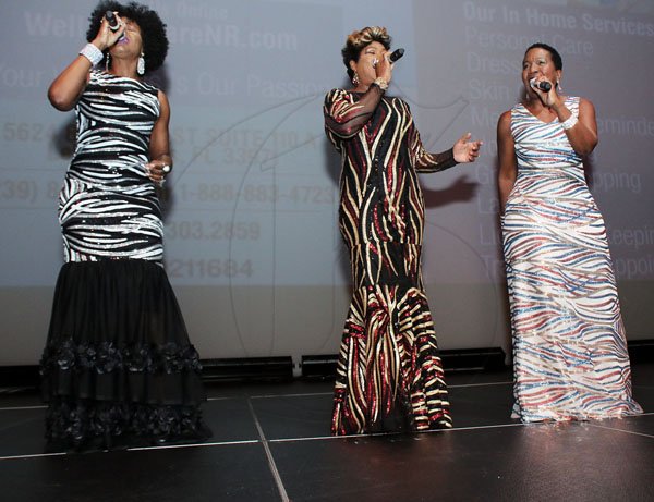 Ashley Anguin<\n>From Left- Gem Myers , Patricia Edwards and Karen Smith as Pakage performing at Cornwall College Dinner dance in South Florida. *** Local Caption *** @Normal:From left: Gem Myers, Patricia Edwards and Karen Smith performing as Pakage at the Cornwall College Alumni Association Dinner Dance in South Florida.