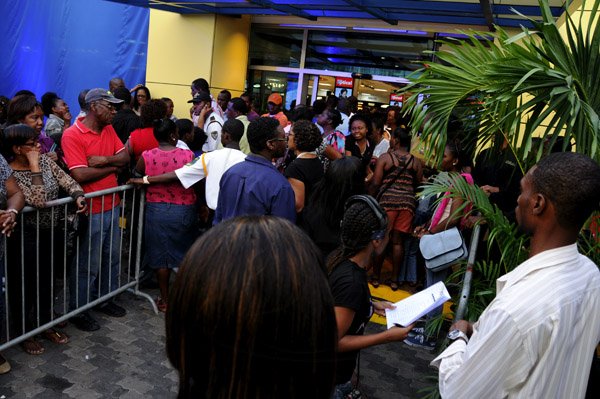 Winston Sill / Freelance Photographer
Prime Minister Portia Simpson-Miller attends the Official Opening and  Grand Unveiling Ceremony of Courts Store, held at Constant Spring Road on Friday evening December 7, 2012. Here crowd outside the store.