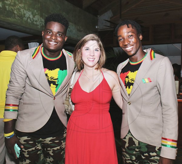 Shakur Brown poses with Bethany McCollum and Orice Dezonie *** Local Caption *** Ashley AnguinBethany McCollum flanked by Shakur Brown (left) and  Orice Dezonie at Couples Negril's  roots, rock, reggae themed anniversary.