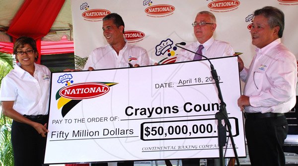 Colin Hamilton/Photographer                                                                                                                                                                                                                                                                                                                                                   Deika Morrison receives a cheque for Fifty Million Dollars from the Chairman of Continental Baking Company Butch Hendrickson (right), participating in the presentation are Education Minister Ronald Thwaites and Director of operations at National Steven Sykes.                                                                                                ..............................................................................................................................................................................................Crayons Count Press Conference - April 18 - Hope Zoo