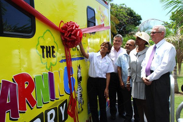 Colin Hamilton/Photographer                                                                                                                                                                                                                                                                                                                                                    (L>R) Founder of Do Good Jamaica Deika Morrison cut the ribbon to officially launch the Mobile Classroom, looking on are Chairman of Continental Baking Company Butch Hendrickson, Monsignor Gregory Ramkissoon, US Ambassador Pamela Bridgewater and Education Minister Ronald Thwaites.                                                                                                ..............................................................................................................................................................................................Crayons Count Press Conference - April 18 - Hope Zoo