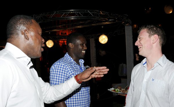Winston Sill / Freelance Photographer
Digicel Jamaica host reception for House of Lords  and Commons Cricket Team, held at the East Lanws, Devon House, Hope Road on Saturday night February 16, 2013. Here are Devon?? Malcolm (left); Wavell Hinds (centre); and ----???? (right).