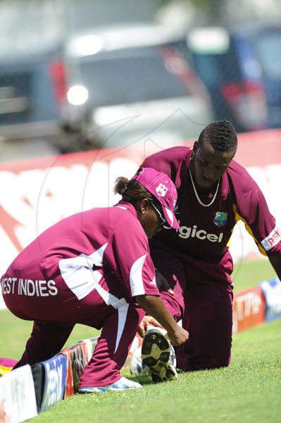 Ricardo Makyn/Staff Photographer
West Indies Bowler Russell receives Medical attention at Sabina Park on  Thursday16.6.2011