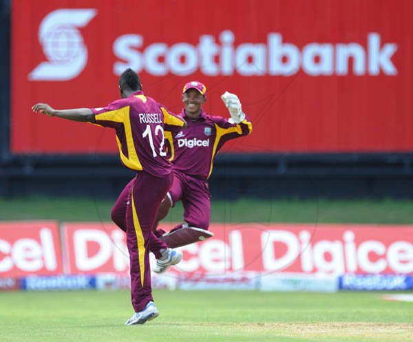Ricardo Makyn/Staff Photographer
West Indies Bowler Russell Celebrates one of His Four Wickets with  Wicket Keeper Baugh  at Sabina Park on  Thursday16.6.2011
