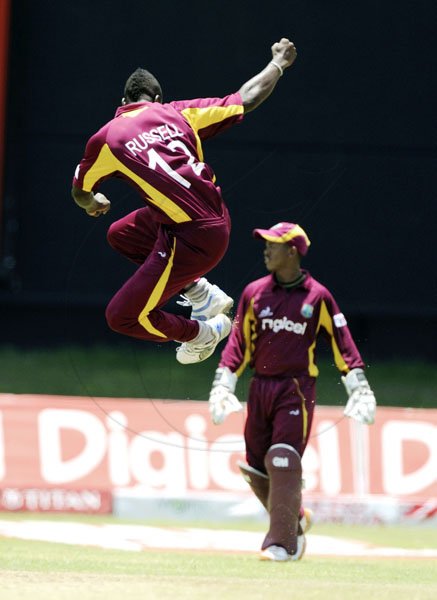 Ricardo Makyn/Staff Photographer
West Indies Bowler Russell Celebrates one of His Four Wickets while Wicket Keeper Baugh looks  on at Sabina Park on  Thursday16.6.2011
