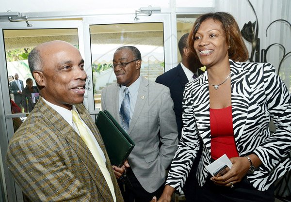Rudolph Brown/ Photographer
Christopher Samuda (left), greets Johanthan Brown, president of the Jamaica Cooperative Credit Union League and Phueona Reynolds, (right) Technical Services Manager of CSS at the Centralized Strategic Services seminar "driving efficiencies through shared services" at the Terra Nova Hotel in Kingston on Wednesday, May 15, 2013