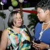 Rudolph Brown/Photographer
Joan Garfield,(left) of NCB Credit Union,  Georgia Morrison at the Credit Union Fund management Company Christmas party at the Spanish Court Hotel in New Kingston on Friday, December 13, 2013