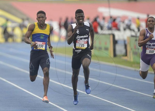 Shorn Hector/Photographer Deondre Mcintosh of jamaica College (center) wins the boys class two 200m on day five of the ISSA/GraceKennedy Boys and Girls’ Athletics Championships held at the The National Stadium in Kingston on Saturday March 30, 2019